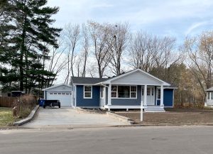 New construction home with blue siding built by Carter Custom Construction