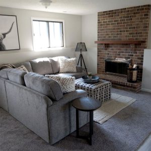 Custom-Basement-Remodel-Fireplace_Twin-Cities)MN Basement living room remodel with traditional brick fireplace, remodel project by Carter Custom Construction