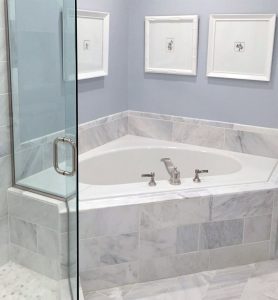 Custom-Bathroom-Soaking-Bathtub_Remodeling_St-Paul_MN Soaking bathtub with a white and light gray marble surrounding, installed by Carter Custom Construction