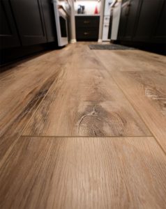 Quality-Custom-Construction_Twin-Cities_MN Close up of quality wood floor installation in a kitchen by Carter Custom Construction