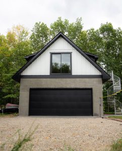 Modern two story garage with living area on second floor, built by Carter Custom Construction