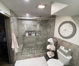 home-basement-bathroom-remodeler_woodbury-mn Remodeled modern looking bathroom with gray tile, by Kitchen remodel with open shelving and white cabinets, by Carter Custom Construction
