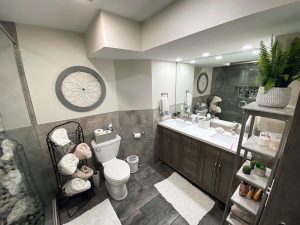 home-bathroom-remodel-modern-gray_minneapolis-mn Bathroom remodel project with gray tile and cabinets by Kitchen remodel with open shelving and white cabinets, by Carter Custom Construction