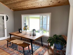 home-remodeling-addition_lakeville-mn Porch addition with vaulted ceiling and sitting area in front of a large window, remodeling by Kitchen remodel with open shelving and white cabinets, by Carter Custom Construction