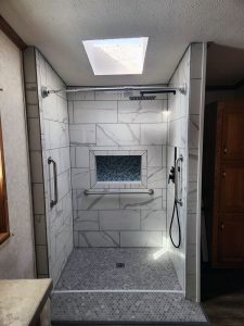 custom-bathroom-shower-remodel_minneapolis-mn bathroom shower remodel with white marble tile, built by Carter Custom Construction