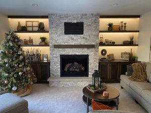 custom-home-remodeling-fireplace-minneapolis_twin-cities_mn living room remodel with a modern stone fireplace with floating shelves with back lighting on both sides, built by Carter Custom Construction