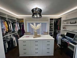 main-level-master-bedroom-closet-remodel_twin-cities High end, elegant large walk-in closet with office space remodel modern bedroom remodel with built in lighting, by Carter Custom Construction