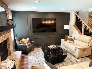 twin-cities-custom-basement-living-area-remodel basement remodel with statement dark gray well with framing details by Carter Custom Construction