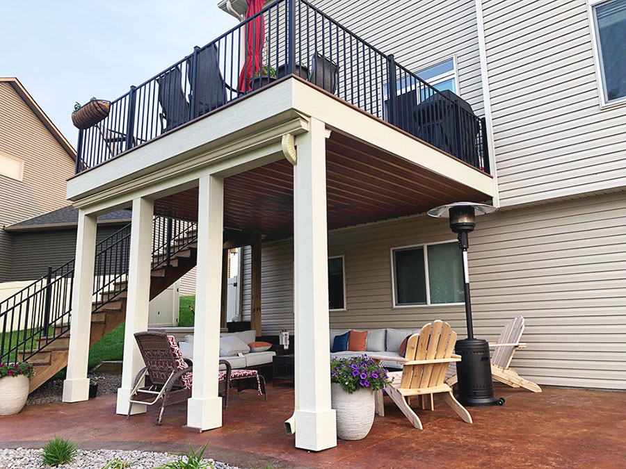 custom deck & porch builder in St. Paul, Minnesota. Custom deck with hang out area underneath, built by Carter Custom Construction