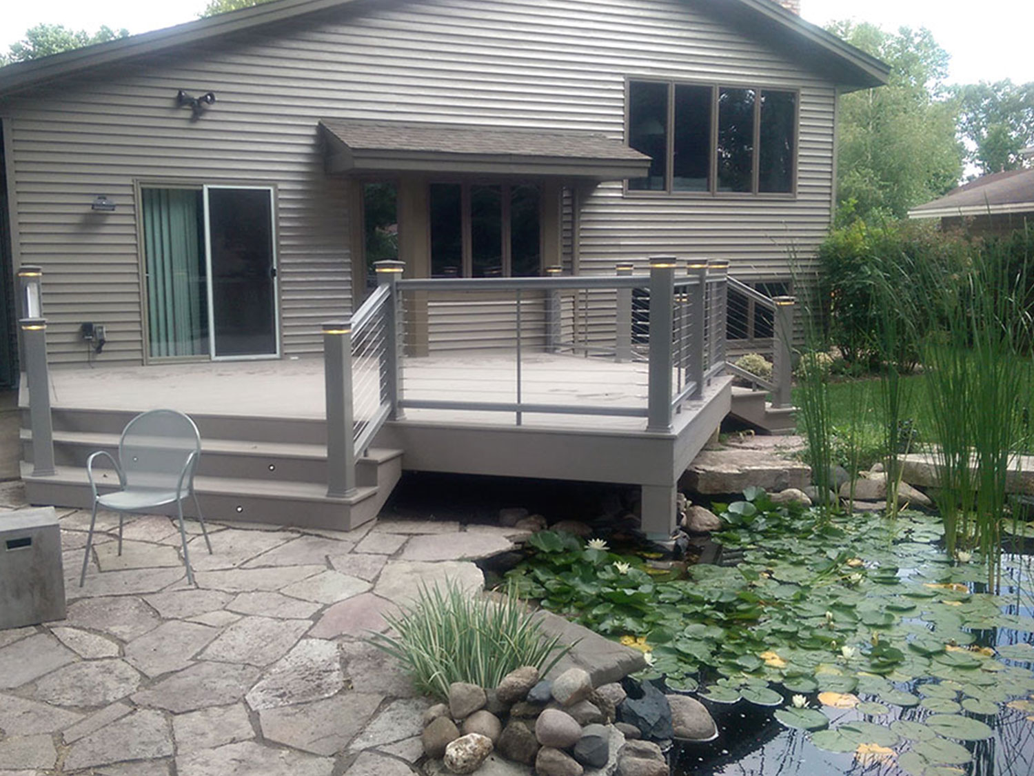 custom deck & porch builder in Minneapolis, MN. Custom built deck over a small pond