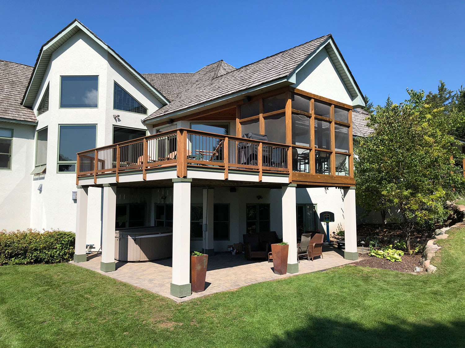 custom deck & porch builder in St. Paul. Wood framed porch addition with attached deck, built by Carter Custom Construction.
